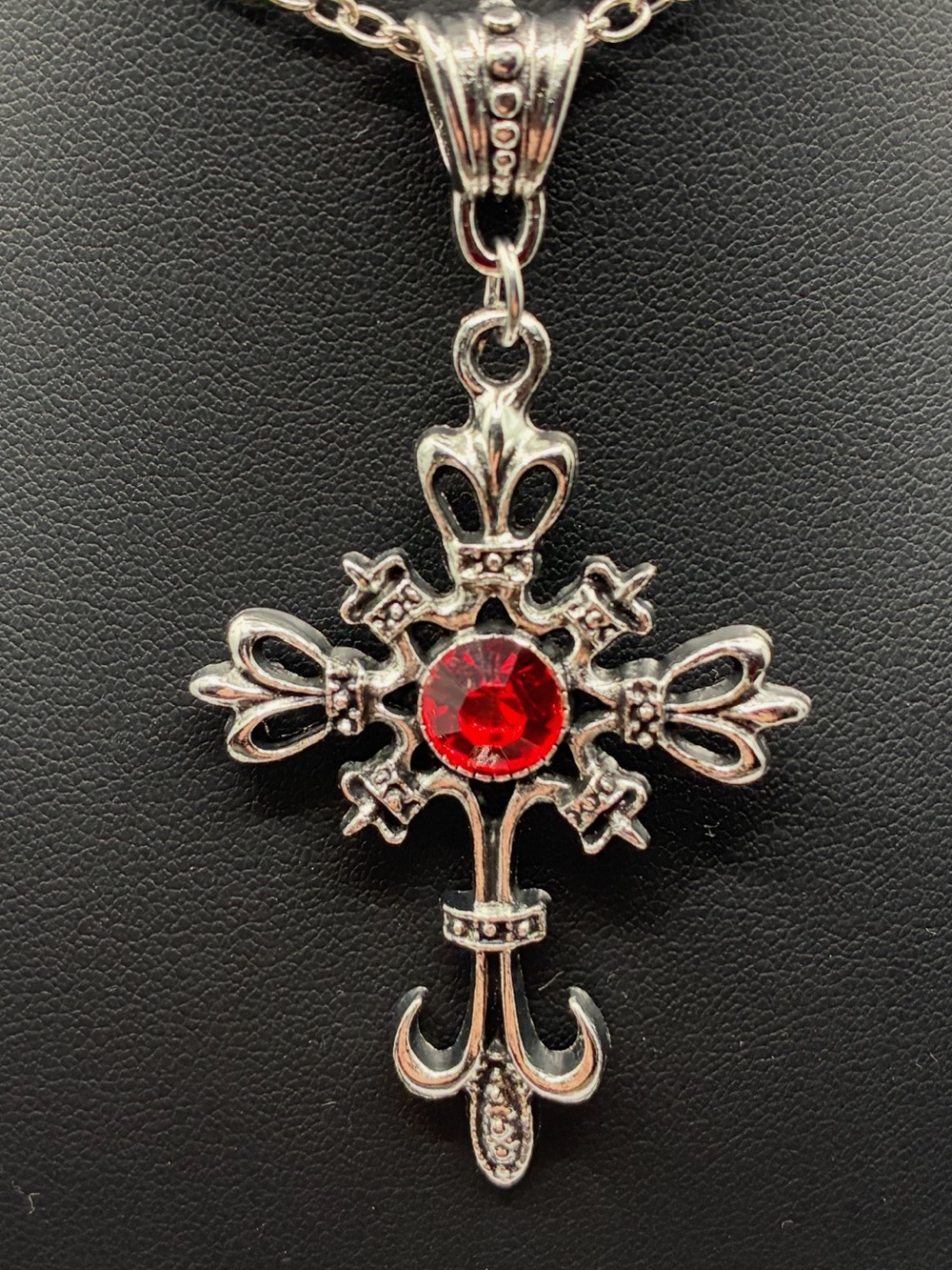 Silver Fleur-de-Lis Cross Necklace with Red Gem Center